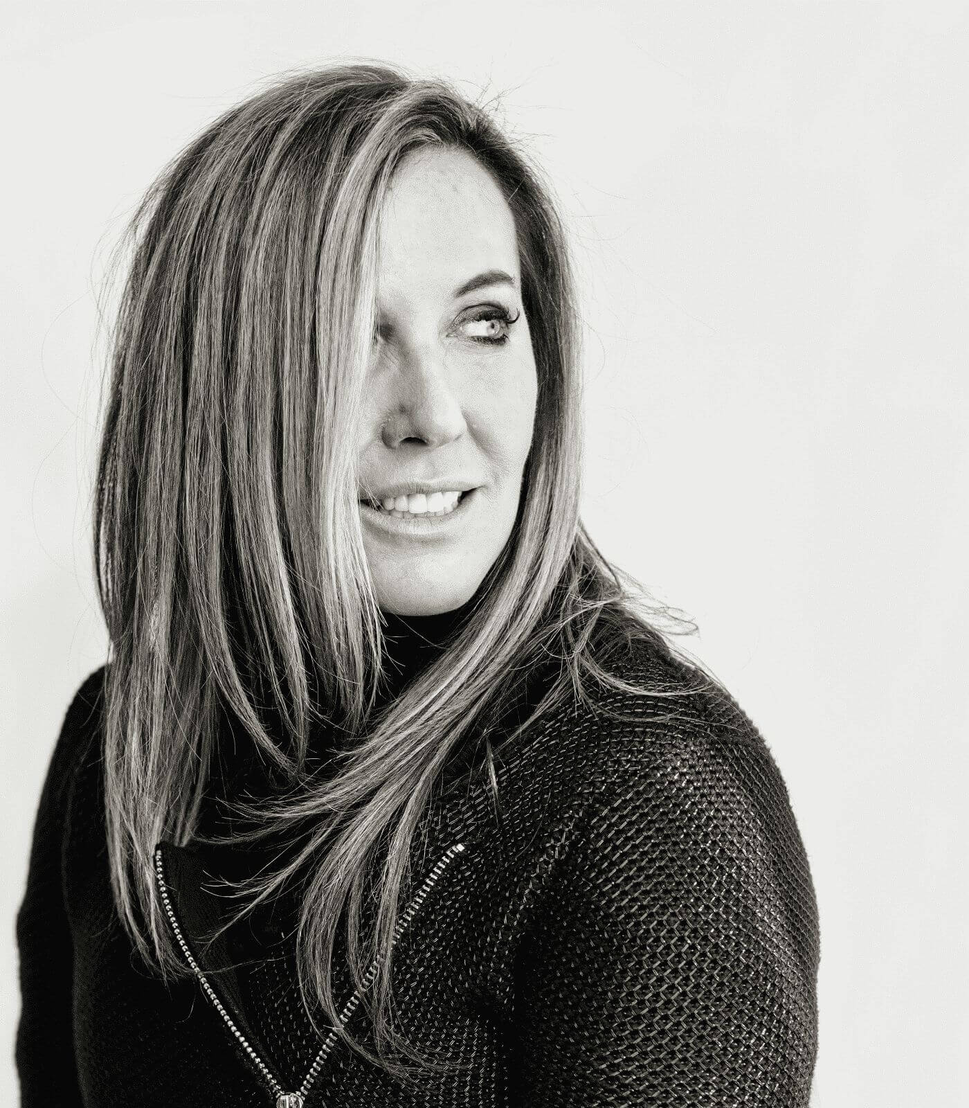 A professional headshot of Dr. Christina Rahm, the founder of Ella Pure, looking confident and knowledgeable.